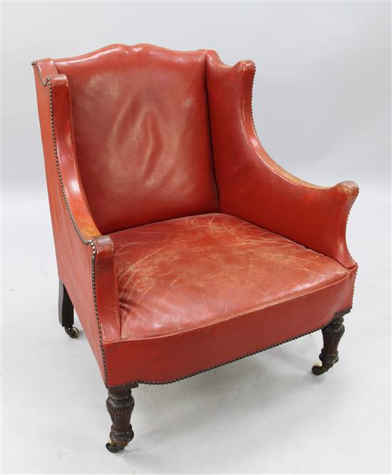 An early Victorian walnut wing armchair, H.3ft 1in.
